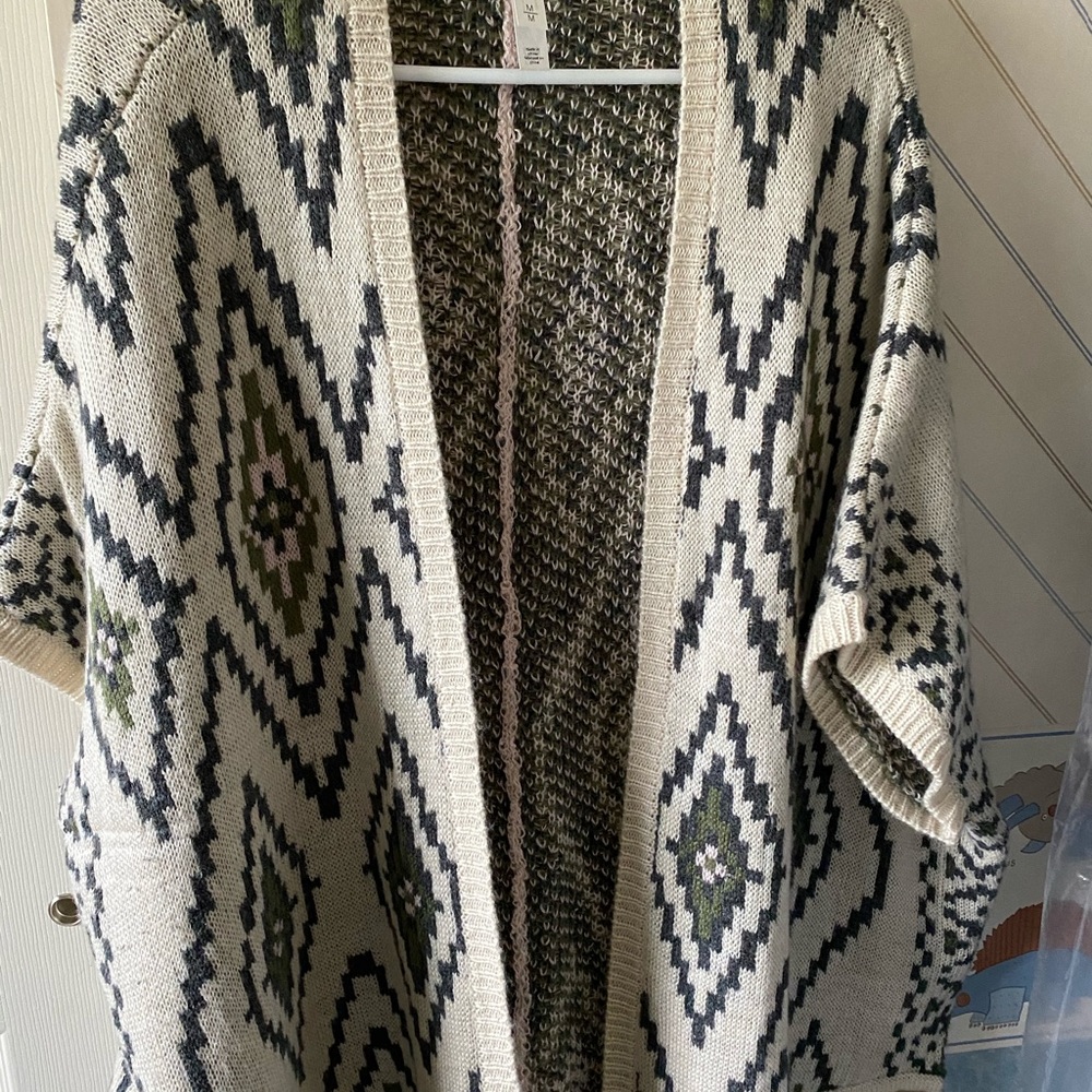 Women’s poncho; has slits for arms, warm and cozy.